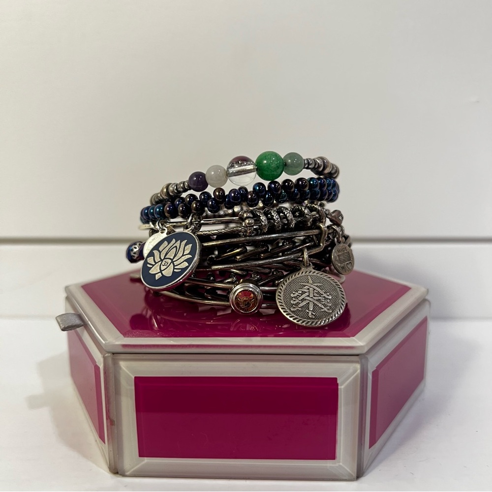 Alex & Ani stylized silver, blue, and purple stacked bangles